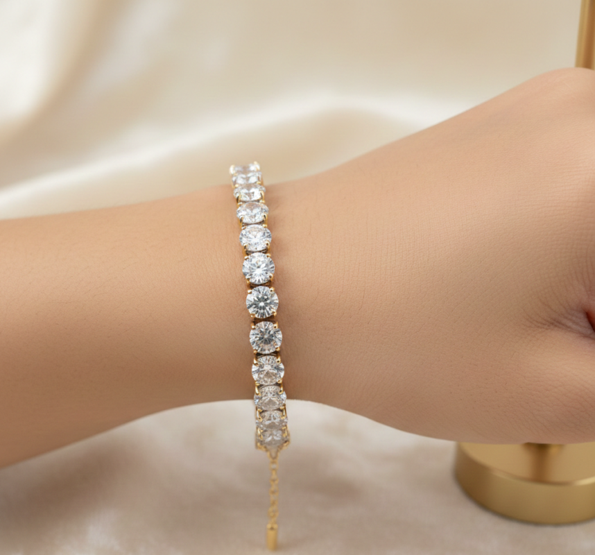 Elegant gold-plated zircon tennis bracelet for women styled on a wrist, featuring sparkling round-cut stones for a luxury fashion look in Pakistan.